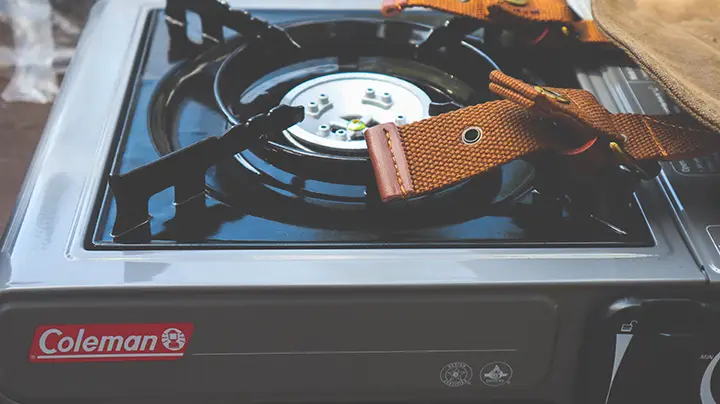 An image of someone adjusting an electric range hood height